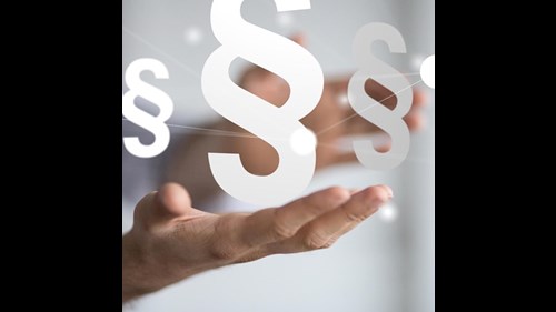 Image of a hand with several paragraph signs hovering above it.